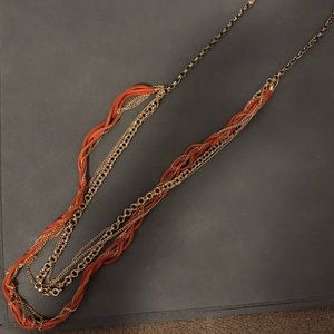 Orange and gold necklace.